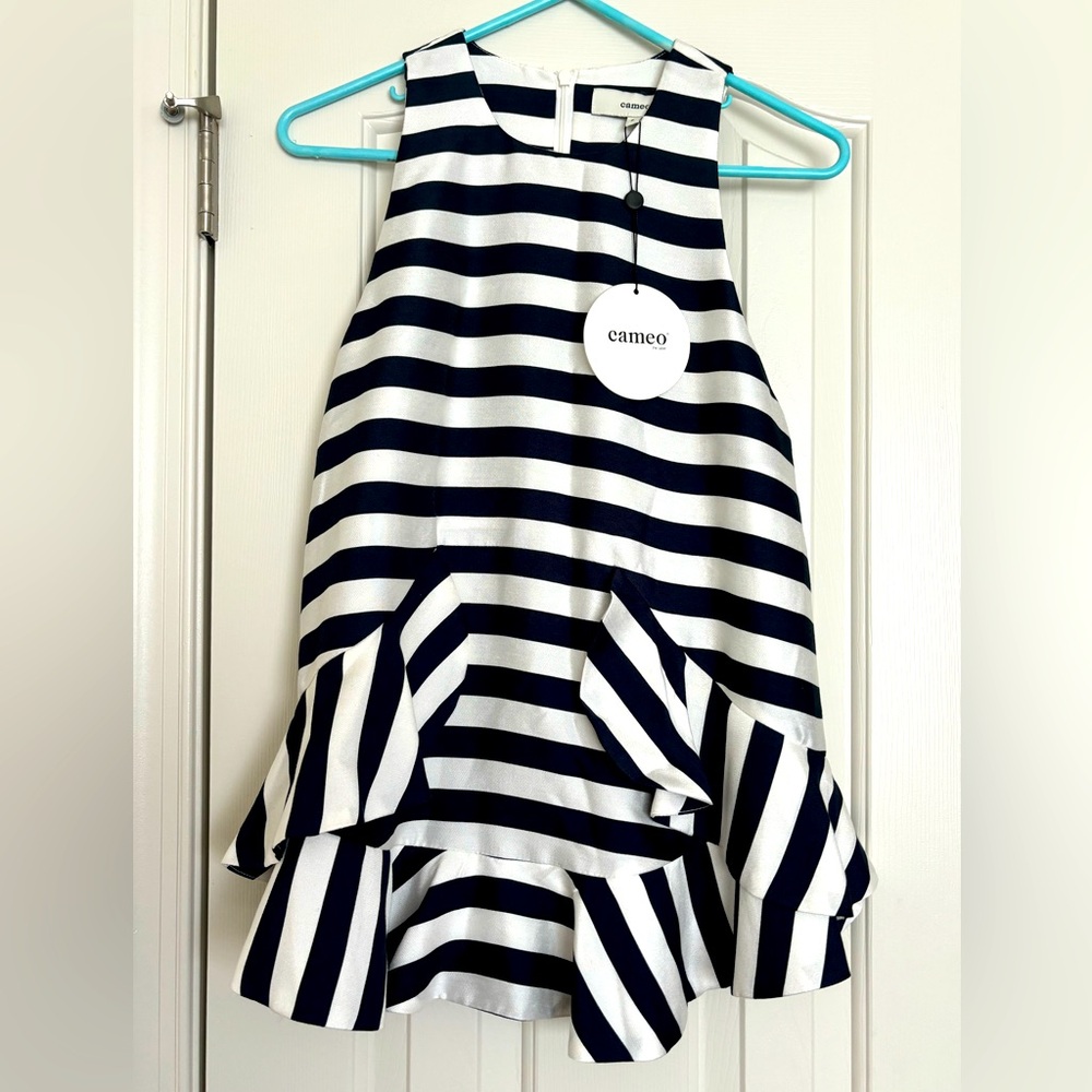 Brand new black & white striped bottom peplum ruffle blouse